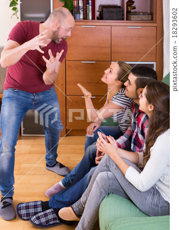 adults playing charades 18293602