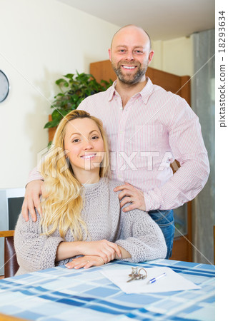 Couple with keys and documents Couple with keys and documents 18293634