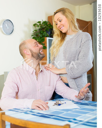 Couple with keys and documents 18293638
