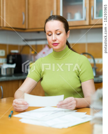 Woman at the table with documents 18293965