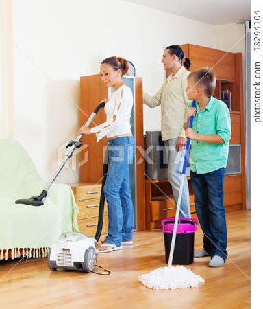 family of three doing housework together family of three doing housework together 18294104