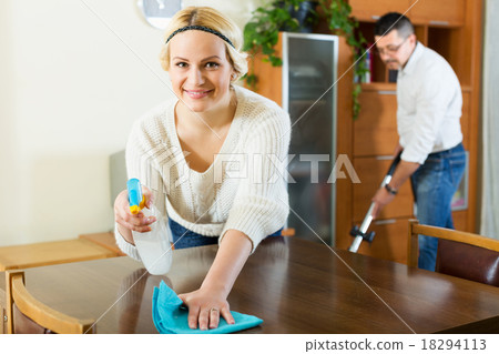 Spouses dusting and hoovering 18294113