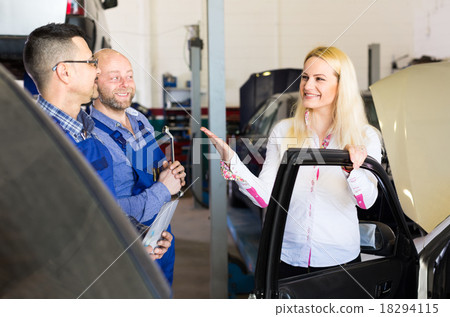 Satisfied customer at car repair shop Satisfied customer at car repair shop 18294115