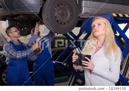 Girl in auto repair shop 18294130