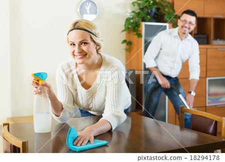 Spouses dusting and hoovering 18294178