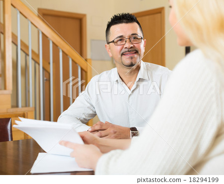 Couple filling questionnaire for employee Couple filling questionnaire for employee 18294199