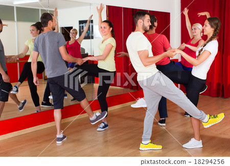 Young adults dancing in a studio. Young adults dancing in a studio. 18294256