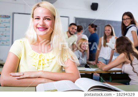 Portrait of smiling female student indoors 18294329