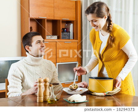 girl serving soup at table 18294373