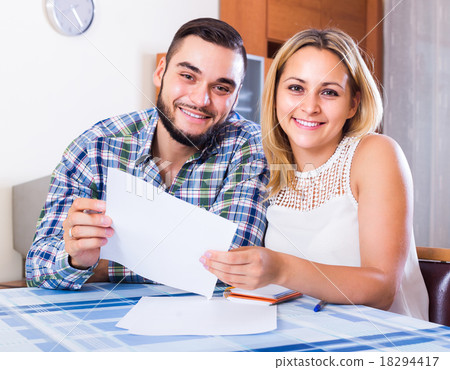 Couple filling forms for bank 18294417