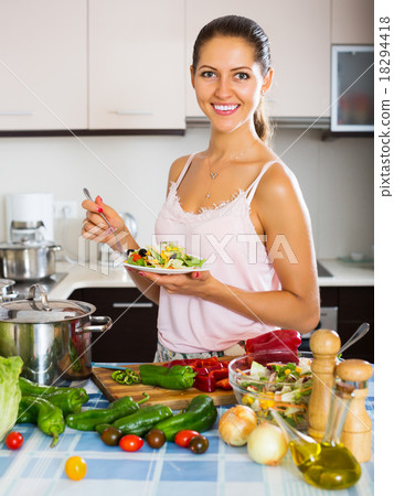 Girl enjoying vegetable salad 18294418