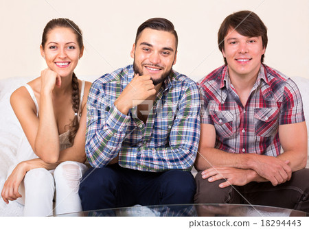 a woman and two men smiling 18294443