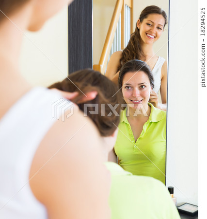 Young girl combing the hair 18294525