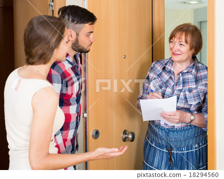 Woman and young family at door 18294560