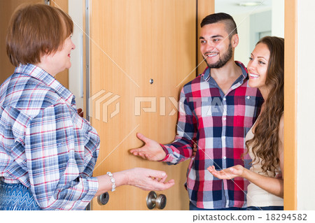 Young couple greeting mother Young couple greeting mother 18294582