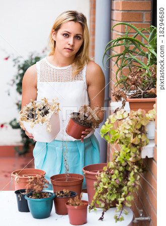 Sad girl with shrunken plants Sad girl with shrunken plants 18294680