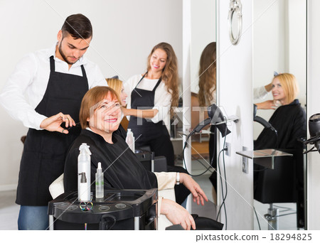 Mature woman in the barbershop. Mature woman in the barbershop. 18294825