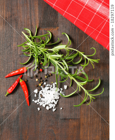 Rosemary, peppercorns and red chili peppers Rosemary, peppercorns and red chili peppers 18297119