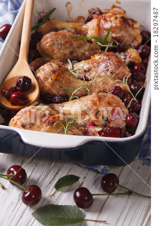 Baked chicken legs with ripe cherry close up Baked chicken legs with ripe cherry close up 18297487