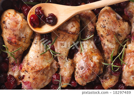 Baked chicken leg with cherry macro top view Baked chicken leg with cherry macro top view 18297489