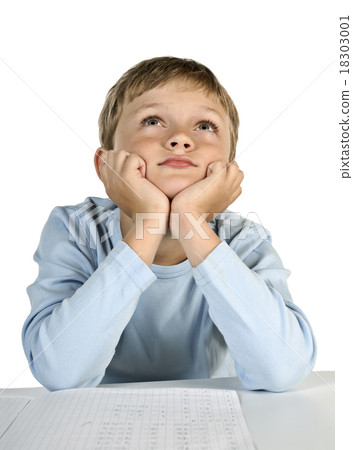 Child sitting at the table and dreams Child sitting at the table and dreams 18303001