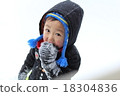Boy playing in the snow 18304836