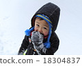Boy playing in the snow 18304837