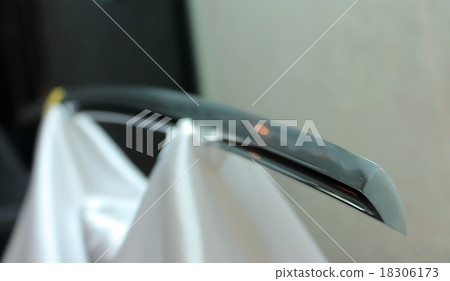 Blade Japanese samurai sword on white silk drapery 18306173