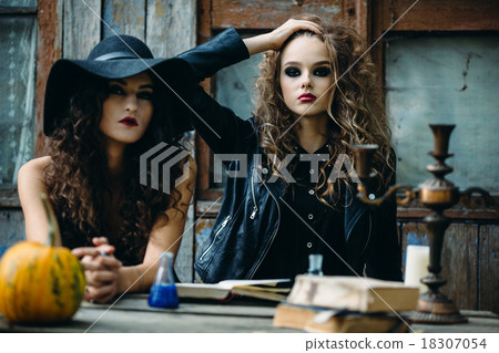 Two vintage witch sitting at the table Two vintage witch sitting at the table 18307054
