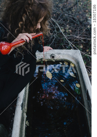 Vintage witch with elixir in hand Vintage witch with elixir in hand 18307186