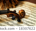 Violin head on sheet music 18307622