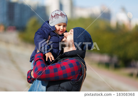 Father and son walking in fall 18308368