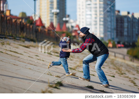 Father and son walking in fall Father and son walking in fall 18308369