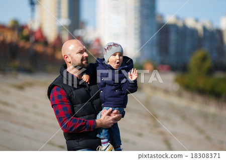 Father and son walking in fall Father and son walking in fall 18308371