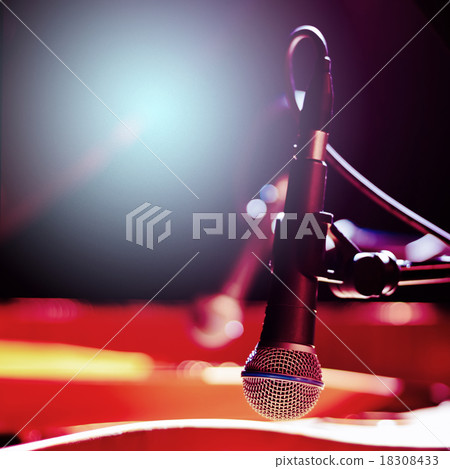 Stylish Microphone on a Blurred Colored Background Stylish Microphone on a Blurred Colored Background 18308433