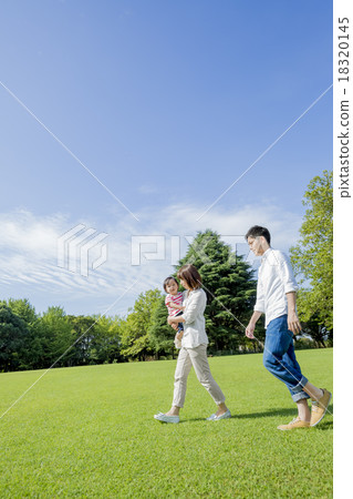 Three people walking in the park 18320145