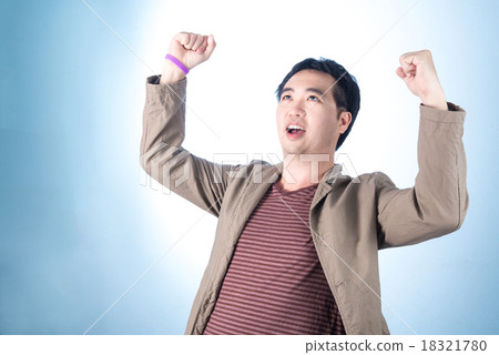 Successful businessman punching the air 18321780