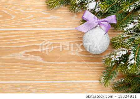 Christmas wooden background with snow fir tree Christmas wooden background with snow fir tree 18324911