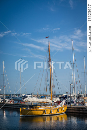 Sailboat in a marine harbor Sailboat in a marine harbor 18325697