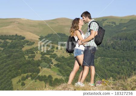 Happy hikers couple in the mountains 18327256