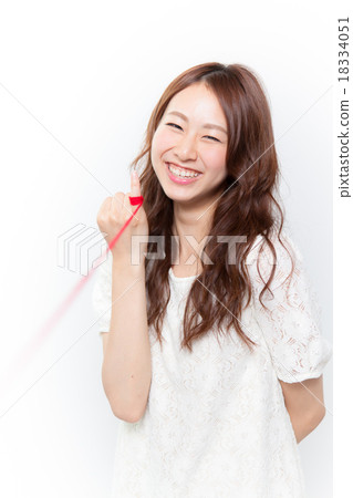 A woman looking at a red line with a little finger 18334051