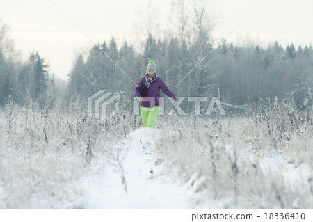 woman in winter forest 18336410