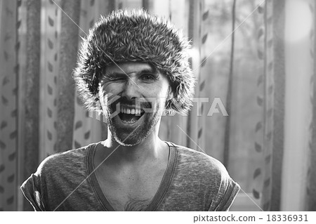 funny portrait of a man in a fur hat funny portrait of a man in a fur hat 18336931