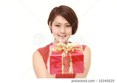 A woman offering a gift 18340829