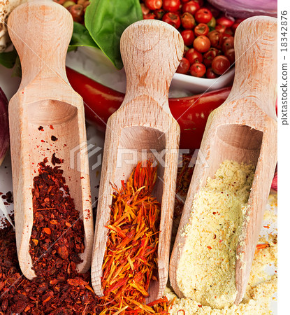 Spices and seasonings close-up as a background Spices and seasonings close-up as a background 18342876