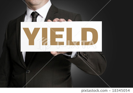 yield sign held by businessman concept 18345054
