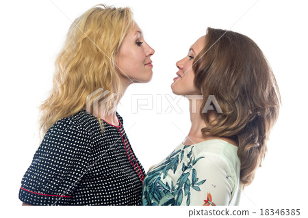Two happy women looking at each other  18346385
