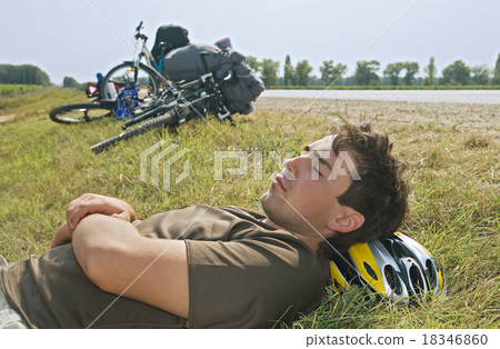 Tired cyclist Tired cyclist 18346860