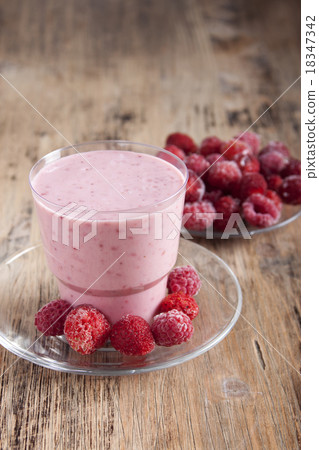 Smoothies of  raspberries and strawberries    . 18347342