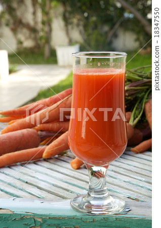A glass of fresh carrot juice 18347550